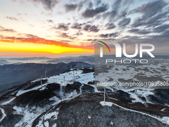 An aerial photo is showing a wind farm operating steadily on a barren mountain in Yichang, China, on January 24, 2024. (