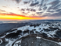 An aerial photo is showing a wind farm operating steadily on a barren mountain in Yichang, China, on January 24, 2024. (