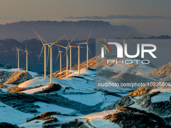 An aerial photo is showing a wind farm operating steadily on a barren mountain in Yichang, China, on January 24, 2024. (