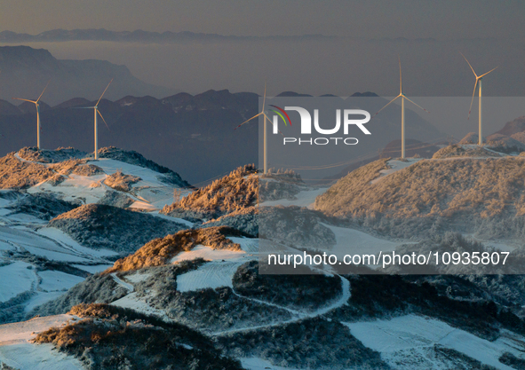 An aerial photo is showing a wind farm operating steadily on a barren mountain in Yichang, China, on January 24, 2024. 