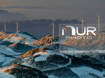 An aerial photo is showing a wind farm operating steadily on a barren mountain in Yichang, China, on January 24, 2024. (