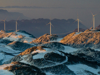 An aerial photo is showing a wind farm operating steadily on a barren mountain in Yichang, China, on January 24, 2024. (