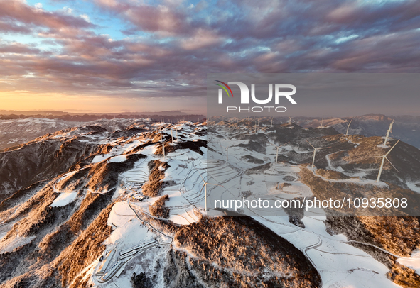 An aerial photo is showing a wind farm operating steadily on a barren mountain in Yichang, China, on January 24, 2024. 