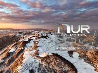 An aerial photo is showing a wind farm operating steadily on a barren mountain in Yichang, China, on January 24, 2024. (