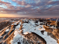 An aerial photo is showing a wind farm operating steadily on a barren mountain in Yichang, China, on January 24, 2024. (