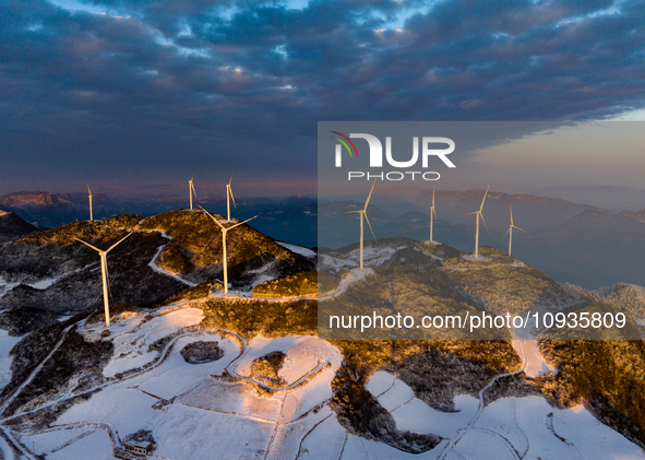 An aerial photo is showing a wind farm operating steadily on a barren mountain in Yichang, China, on January 24, 2024. 