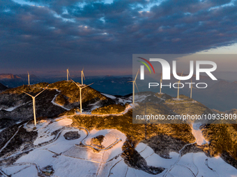 An aerial photo is showing a wind farm operating steadily on a barren mountain in Yichang, China, on January 24, 2024. (