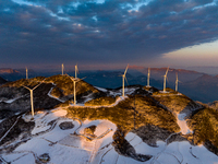 An aerial photo is showing a wind farm operating steadily on a barren mountain in Yichang, China, on January 24, 2024. (