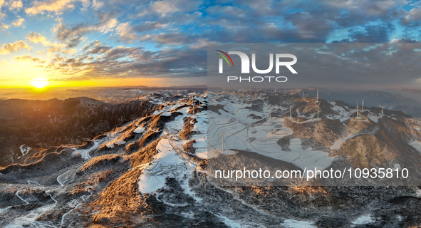 An aerial photo is showing a wind farm operating steadily on a barren mountain in Yichang, China, on January 24, 2024. 