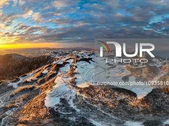 An aerial photo is showing a wind farm operating steadily on a barren mountain in Yichang, China, on January 24, 2024. (