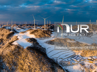 An aerial photo is showing a wind farm operating steadily on a barren mountain in Yichang, China, on January 24, 2024. (