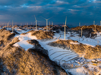 An aerial photo is showing a wind farm operating steadily on a barren mountain in Yichang, China, on January 24, 2024. (