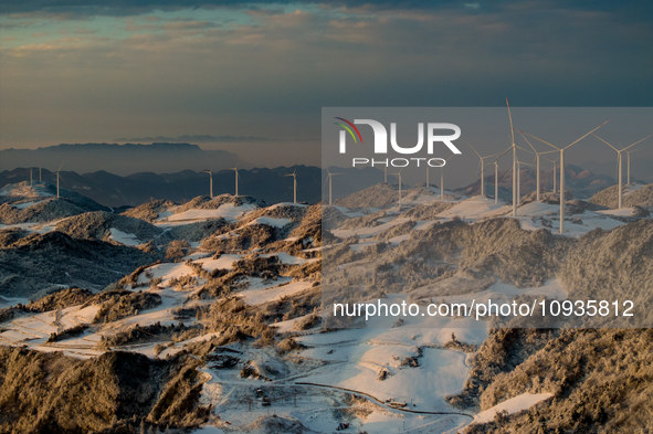 An aerial photo is showing a wind farm operating steadily on a barren mountain in Yichang, China, on January 24, 2024. 