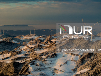 An aerial photo is showing a wind farm operating steadily on a barren mountain in Yichang, China, on January 24, 2024. (