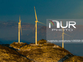 An aerial photo is showing a wind farm operating steadily on a barren mountain in Yichang, China, on January 24, 2024. (