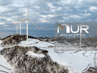 An aerial photo is showing a wind farm operating steadily on a barren mountain in Yichang, China, on January 24, 2024. (