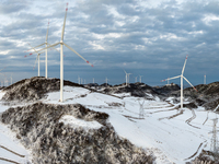 An aerial photo is showing a wind farm operating steadily on a barren mountain in Yichang, China, on January 24, 2024. (