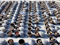 Workers are checking the drying of sauces in a drying field at a soy sauce factory in Lianyungang, Jiangsu Province, China, on January 24, 2...