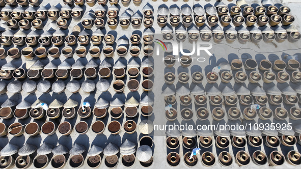 Workers are checking the drying of sauces in a drying field at a soy sauce factory in Lianyungang, Jiangsu Province, China, on January 24, 2...