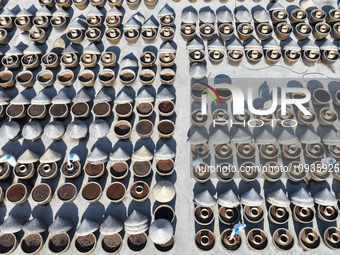 Workers are checking the drying of sauces in a drying field at a soy sauce factory in Lianyungang, Jiangsu Province, China, on January 24, 2...