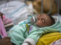 Abdul Ahad, who is three months old, is receiving medical treatment for pneumonia at Dhaka Shishu Hospital in Dhaka, Bangladesh, on January...