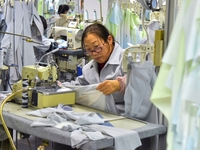 A worker is making sun-protective clothing products in Nantong, Jiangsu Province, China, on January 24, 2024. (