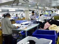 Workers are producing clothing products in Nantong, Jiangsu Province, China, on January 24, 2024. (