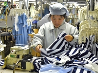 Workers are producing clothing products in Nantong, Jiangsu Province, China, on January 24, 2024. (