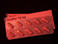 A box and a tablet of Roche Pharmaceuticals' Tamiflu pills for influenza are shown. (