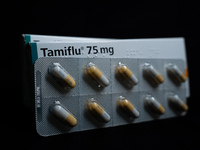 A box and a tablet of Roche Pharmaceuticals' Tamiflu pills for influenza are shown. (