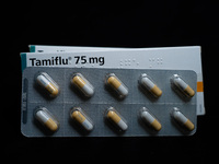 A box and a tablet of Roche Pharmaceuticals' Tamiflu pills for influenza are shown. (