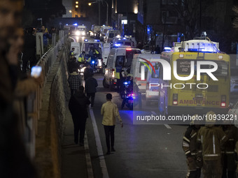 Ambulances and firefighters are at the site of the fire at the Gandhi Hotel Hospital in northern Tehran, on January 25, 2024. Patients are b...