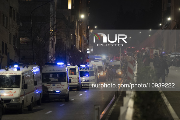 Ambulances and firefighters are at the site of the fire at the Gandhi Hotel Hospital in northern Tehran, on January 25, 2024. Patients are b...