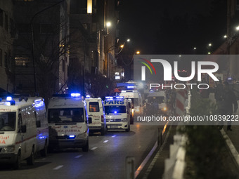 Ambulances and firefighters are at the site of the fire at the Gandhi Hotel Hospital in northern Tehran, on January 25, 2024. Patients are b...