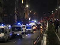 Ambulances and firefighters are at the site of the fire at the Gandhi Hotel Hospital in northern Tehran, on January 25, 2024. Patients are b...