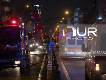 Ambulances and firefighters are at the site of the fire at the Gandhi Hotel Hospital in northern Tehran, on January 25, 2024. Patients are b...