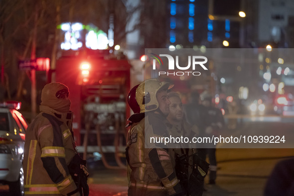 Firefighters are at the site of the fire at the Gandhi hotel hospital in northern Tehran, Iran, on January 25, 2024. They are safely evacuat...