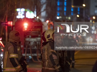 Firefighters are at the site of the fire at the Gandhi hotel hospital in northern Tehran, Iran, on January 25, 2024. They are safely evacuat...