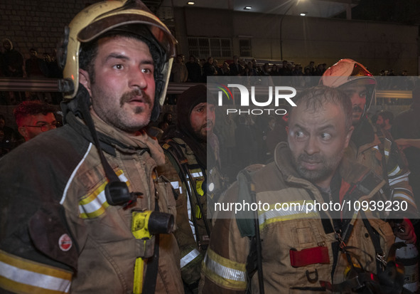 Firefighters are at the site of the fire at the Gandhi hotel hospital in northern Tehran, Iran, on January 25, 2024. They are safely evacuat...