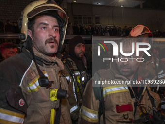 Firefighters are at the site of the fire at the Gandhi hotel hospital in northern Tehran, Iran, on January 25, 2024. They are safely evacuat...