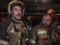 Firefighters are at the site of the fire at the Gandhi hotel hospital in northern Tehran, Iran, on January 25, 2024. They are safely evacuat...