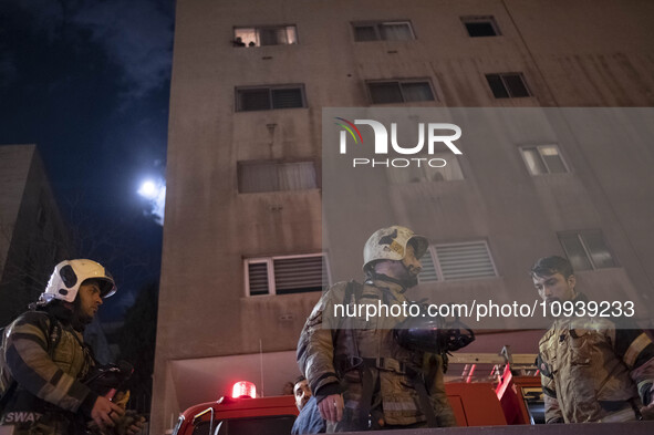 Firefighters are at the site of the fire at the Gandhi hotel hospital in northern Tehran, Iran, on January 25, 2024. They are safely evacuat...