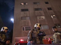 Firefighters are at the site of the fire at the Gandhi hotel hospital in northern Tehran, Iran, on January 25, 2024. They are safely evacuat...