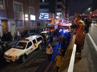 Ambulances and firefighters are at the site of the fire at the Gandhi Hotel Hospital in northern Tehran, on January 25, 2024. Patients are b...