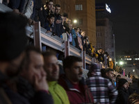 People are watching while standing at the site of the fire at the Gandhi hotel hospital in northern Tehran, Iran, on January 25, 2024. Patie...