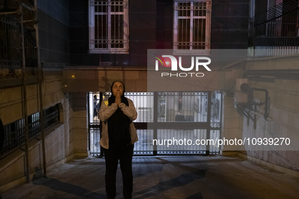 An Iranian woman is reacting while standing near the site of the fire at the Gandhi hotel hospital in northern Tehran, Iran, on January 25,...