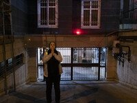 An Iranian woman is reacting while standing near the site of the fire at the Gandhi hotel hospital in northern Tehran, Iran, on January 25,...