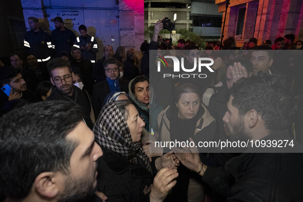 Relatives of a patient are gathering at the site of the fire at the Gandhi Hotel Hospital in northern Tehran, Iran, on January 25, 2024. Pat...