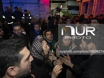 Relatives of a patient are gathering at the site of the fire at the Gandhi Hotel Hospital in northern Tehran, Iran, on January 25, 2024. Pat...