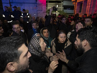 Relatives of a patient are gathering at the site of the fire at the Gandhi Hotel Hospital in northern Tehran, Iran, on January 25, 2024. Pat...